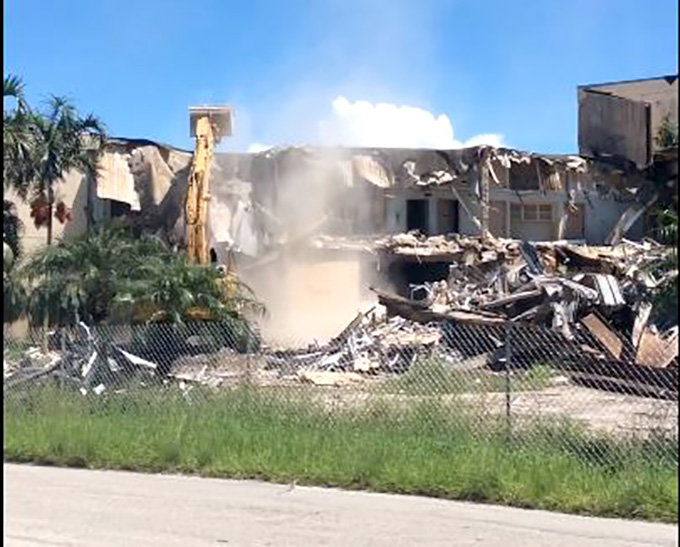 PAHOKEE — Dust clouds rise as demolition of the old Everglades Memorial Hospital begins; this photo is a still from a video taken over the weekend.